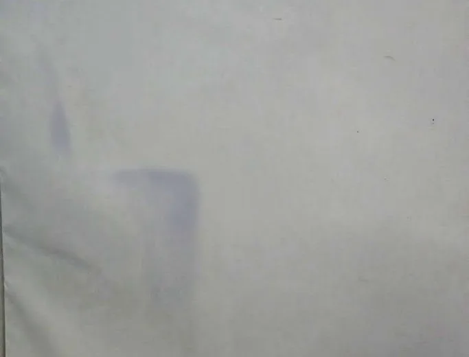 Blue dye stain on a white gym wall pad